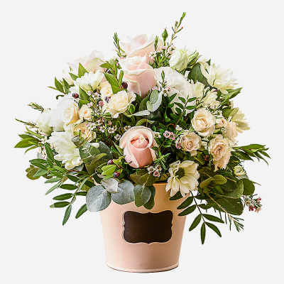 Dawn - An inspiration from nature . A flower gift perfectly arranged in a container using pale shaded flowers and foliage.
