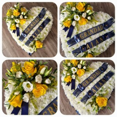 Heart tribute - Lovely heart tribute with massed white chrysanths and a yellow cluster. Choice of colours available.  Ribbon letters extra.